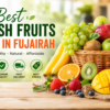 Fresh fruits basket with apples, grapes, oranges, bananas, and mangoes promoting the best fresh fruits shop in Fujairah UAE